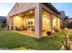 Inviting covered patio with lounge seating and well-manicured turf, perfect for outdoor entertaining at 8691 E Eastwood Cir, Carefree, AZ 85377