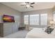 Bright bedroom featuring large windows, neutral decor, and a ceiling fan at 8691 E Eastwood Cir, Carefree, AZ 85377