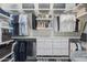 Organized walk-in closet with shelving, drawers, and ample hanging space for clothes and accessories at 8691 E Eastwood Cir, Carefree, AZ 85377