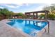 Resort-style community pool with ample lounge seating and shaded pergola for relaxation at 8691 E Eastwood Cir, Carefree, AZ 85377