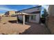 Private backyard with a pergola patio and low-maintenance desert landscaping at 8854 W Aster Dr, Peoria, AZ 85381