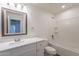 Bathroom vanity with white cabinets, a white countertop and a bathtub at 8854 W Aster Dr, Peoria, AZ 85381