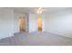 Large bedroom with neutral carpet and adjoining bathroom at 8854 W Aster Dr, Peoria, AZ 85381