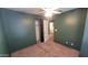 Green bedroom with empty closet, window with blinds, and a ceiling fan at 8854 W Aster Dr, Peoria, AZ 85381