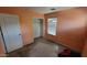 Bedroom with an empty closet, window with blinds and peach-colored walls at 8854 W Aster Dr, Peoria, AZ 85381