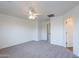 Bedroom with neutral carpet and access to connecting rooms at 8854 W Aster Dr, Peoria, AZ 85381