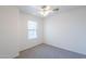 Bright bedroom with a ceiling fan and a window providing natural light at 8854 W Aster Dr, Peoria, AZ 85381