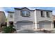 Charming two-story home featuring a two-car garage and neutral stucco exterior at 8854 W Aster Dr, Peoria, AZ 85381