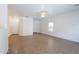 Neutral living room featuring a tile floor, bright white walls and a ceiling fan at 8854 W Aster Dr, Peoria, AZ 85381