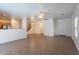 Spacious living room with tiled flooring, neutral wall color and an open layout to the kitchen at 8854 W Aster Dr, Peoria, AZ 85381