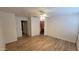 Spacious main bedroom with updated laminate flooring, ceiling fan, and neutral paint at 8854 W Aster Dr, Peoria, AZ 85381