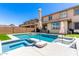Inviting backyard with a pool and outdoor seating, ideal for entertaining and enjoying sunny days at 9342 W White Feather Ln, Peoria, AZ 85383