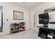 Neutral bedroom space with carpet, closet access, and additional space for a desk or storage at 9342 W White Feather Ln, Peoria, AZ 85383
