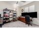 Versatile bedroom features a ceiling fan, window, and functional furniture setup for comfortable living at 9342 W White Feather Ln, Peoria, AZ 85383