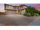Charming two-story home featuring a spacious driveway and two-car garage, perfect for families at 9342 W White Feather Ln, Peoria, AZ 85383