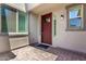 Charming front entrance featuring a beautiful door, sidelights, and a welcoming porch area at 9342 W White Feather Ln, Peoria, AZ 85383