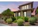 Landscaped front yard with well-maintained bushes, adding curb appeal to this beautiful home at 9342 W White Feather Ln, Peoria, AZ 85383