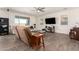 Bright living room with a ceiling fan and tile floors, offering a comfortable and spacious living area at 9342 W White Feather Ln, Peoria, AZ 85383