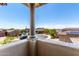Balcony view overlooking a well-maintained neighborhood with houses and greenery at 9342 W White Feather Ln, Peoria, AZ 85383