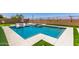 Refreshing pool area with clean lines and manicured turf, perfect for backyard enjoyment and leisure at 9342 W White Feather Ln, Peoria, AZ 85383