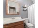 Bathroom featuring single vanity, decorative shelves, and shower with patterned curtain at 10351 W Carlota Ln, Peoria, AZ 85383
