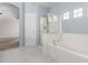 A pristine bathroom with a glass-enclosed shower, soaking tub, and tile flooring at 10351 W Carlota Ln, Peoria, AZ 85383