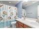 Bright bathroom features double vanity and a cheerful mermaid-themed shower curtain at 10351 W Carlota Ln, Peoria, AZ 85383