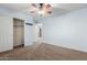Bright bedroom featuring neutral walls, plush carpet, and generous closet space at 10351 W Carlota Ln, Peoria, AZ 85383