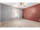 Bedroom showcasing neutral tones with a ceiling fan and carpeted floor at 10351 W Carlota Ln, Peoria, AZ 85383