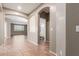 Spacious entryway featuring neutral colors, arched openings, and tile flooring at 10351 W Carlota Ln, Peoria, AZ 85383