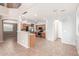 Open kitchen layout with stainless steel appliances, wood cabinetry, and adjacent dining area at 10351 W Carlota Ln, Peoria, AZ 85383