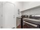 Modern laundry room equipped with a side-by-side washer and dryer at 10351 W Carlota Ln, Peoria, AZ 85383