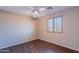 Bright bedroom with wood-look flooring and bright windows at 10517 W La Reata Ave, Avondale, AZ 85392