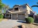Charming two-story home with a three-car garage and well-maintained landscaping at 10517 W La Reata Ave, Avondale, AZ 85392
