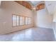 Open and airy living space with soaring ceilings, plentiful natural light, and neutral finishes at 10517 W La Reata Ave, Avondale, AZ 85392