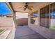 Covered patio with a ceiling fan, concrete flooring, and view of the block wall at 10517 W La Reata Ave, Avondale, AZ 85392