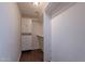 Walk-in closet with wood-look flooring and closet system at 10517 W La Reata Ave, Avondale, AZ 85392