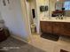 Functional bathroom featuring dual vanity, plenty of storage, and a tiled floor at 10610 S 48Th St # 1074, Phoenix, AZ 85044