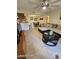 Inviting living room featuring tiled floors, a comfortable couch, and a dining area adjacent to the kitchen at 10610 S 48Th St # 1074, Phoenix, AZ 85044
