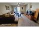 Comfortable living room with neutral tones, tile flooring, and access to outdoor space at 10610 S 48Th St # 1074, Phoenix, AZ 85044