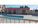 Community swimming pool and adjacent jacuzzi are fenced in, promoting resident safety at 10610 S 48Th St # 1074, Phoenix, AZ 85044