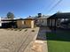 The spacious backyard includes a covered patio area and desert-friendly landscaping at 112 W Vogel Ave, Phoenix, AZ 85021