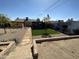 Landscaped backyard with desert landscaping, patio, and covered area perfect for entertaining at 112 W Vogel Ave, Phoenix, AZ 85021