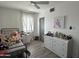 Cozy bedroom featuring white walls, wood-look floors, and a bright, airy atmosphere at 112 W Vogel Ave, Phoenix, AZ 85021