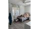 Bright bedroom featuring a metal bed frame, wood-look flooring, and white walls at 112 W Vogel Ave, Phoenix, AZ 85021