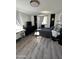 Bedroom with black and white accent walls, wood-look flooring, and a minimalist design at 112 W Vogel Ave, Phoenix, AZ 85021