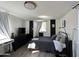 Bedroom with black and white accent walls, wood-look flooring, and a minimalist design at 112 W Vogel Ave, Phoenix, AZ 85021