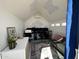 Modern bonus room featuring a vaulted ceiling with soundproofing tiles, and a work-from-home setup at 112 W Vogel Ave, Phoenix, AZ 85021
