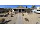 Quaint home with desert landscaping, walkway, and mountain view at 112 W Vogel Ave, Phoenix, AZ 85021