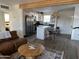 Open-concept living area flowing into the kitchen with stainless steel appliances at 112 W Vogel Ave, Phoenix, AZ 85021